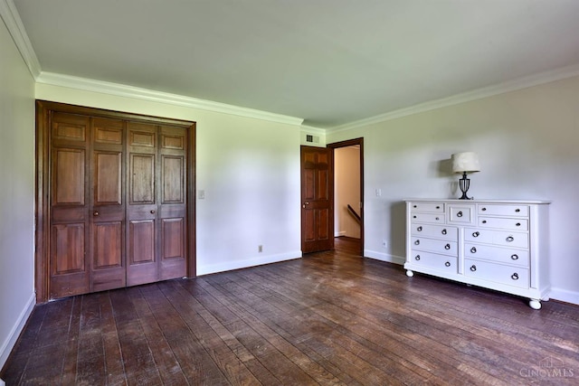 254 Compton Rd, Wyoming, OH 45215 - unfurnished bedroom featuring ornamental molding, dark wood-style flooring, and a closet