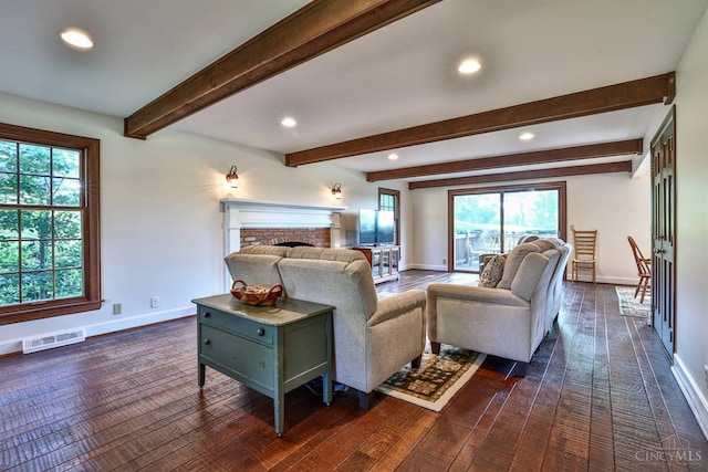 254 Compton Rd, Wyoming, OH 45215 - living area with dark wood-style floors, a fireplace, recessed lighting, healthy amount of natural light, and beam ceiling