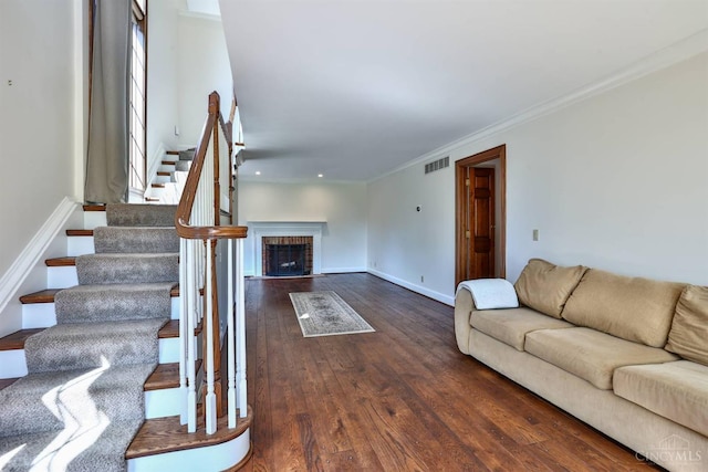 254 Compton Rd, Wyoming, OH 45215 - living room with wood finished floors, stairway, a fireplace, crown molding, and recessed lighting