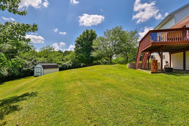 2487 Haddock Dr, Lawrenceburg, IN 47025 - view of green lawn with a storage shed, a deck, and stairs