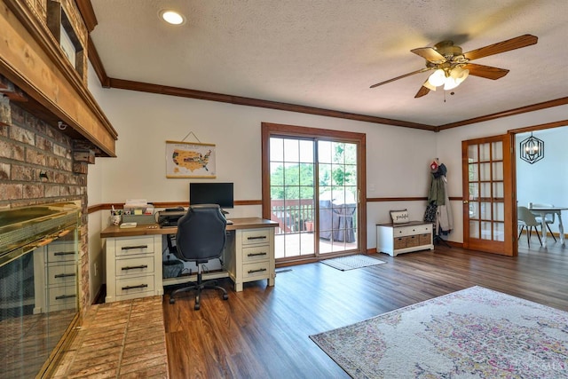 2487 Haddock Dr, Lawrenceburg, IN 47025 - office featuring ornamental molding, wood finished floors, ceiling fan, a fireplace, and a textured ceiling