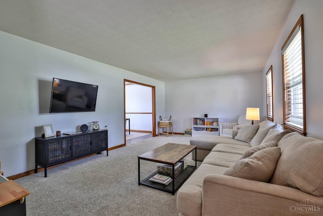 2487 Haddock Dr, Lawrenceburg, IN 47025 - carpeted living room featuring baseboards and a textured ceiling