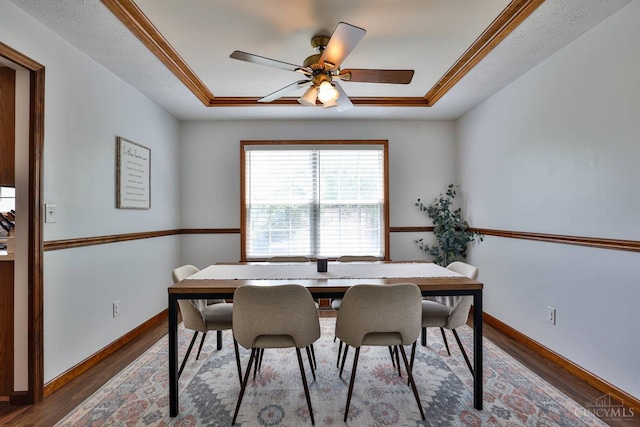 2487 Haddock Dr, Lawrenceburg, IN 47025 - dining room with a raised ceiling, wood finished floors, and ceiling fan