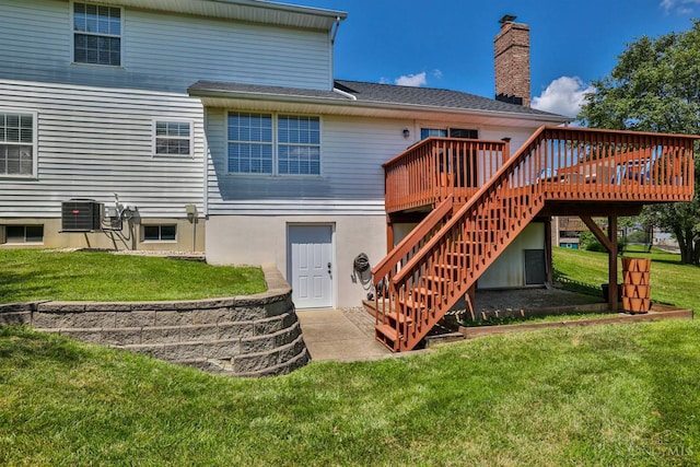 2487 Haddock Dr, Lawrenceburg, IN 47025 - rear view of property featuring stairs, a deck, a lawn, and a chimney