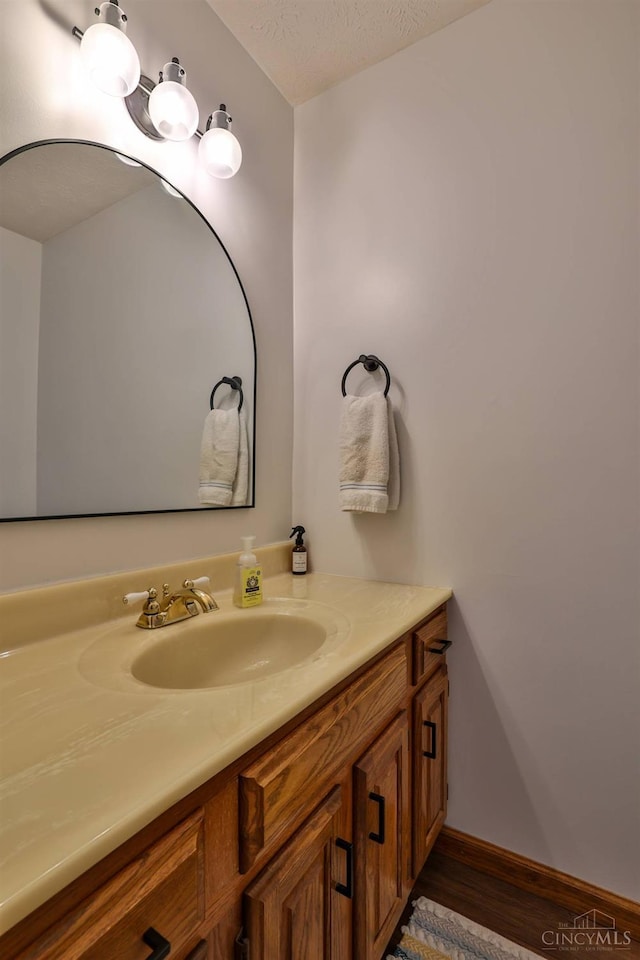 2487 Haddock Dr, Lawrenceburg, IN 47025 - bathroom featuring vanity and wood finished floors