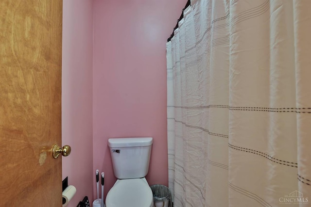 2487 Haddock Dr, Lawrenceburg, IN 47025 - bathroom featuring toilet and a shower with shower curtain
