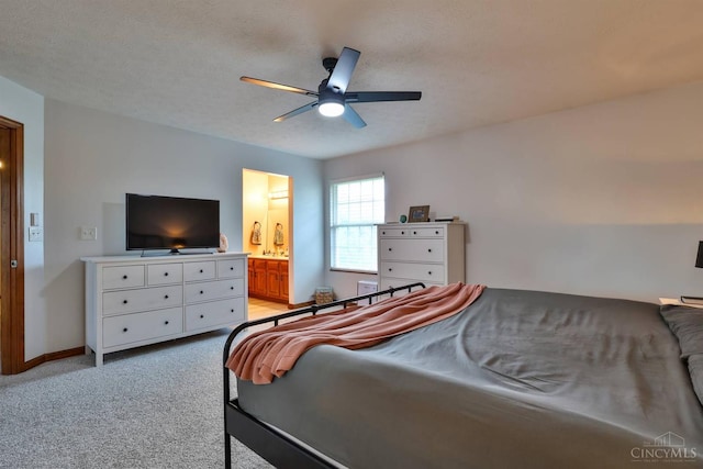 2487 Haddock Dr, Lawrenceburg, IN 47025 - bedroom with light carpet, ensuite bath, and a ceiling fan