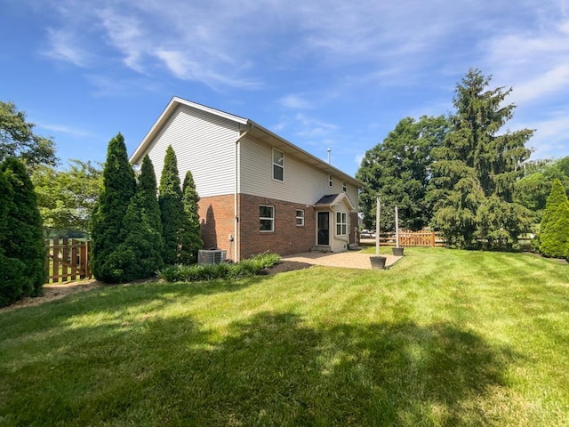 6336 Lansing Ct, Liberty Twp, OH 45011 - back of property featuring brick siding and a patio area