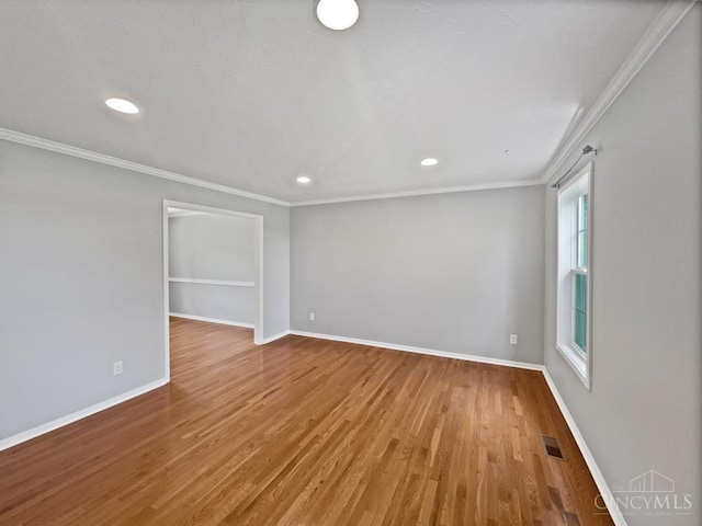 6336 Lansing Ct, Liberty Twp, OH 45011 - spare room featuring wood finished floors, ornamental molding, and recessed lighting