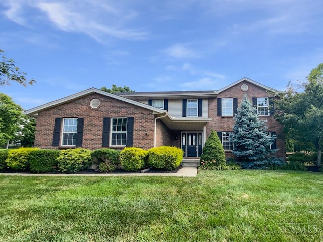 6336 Lansing Ct, Liberty Twp, OH 45011 - view of front of house with brick siding and a front lawn