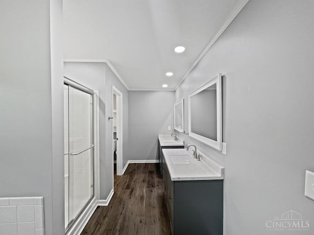 6336 Lansing Ct, Liberty Twp, OH 45011 - full bathroom featuring double vanity, ornamental molding, a stall shower, wood finished floors, and recessed lighting