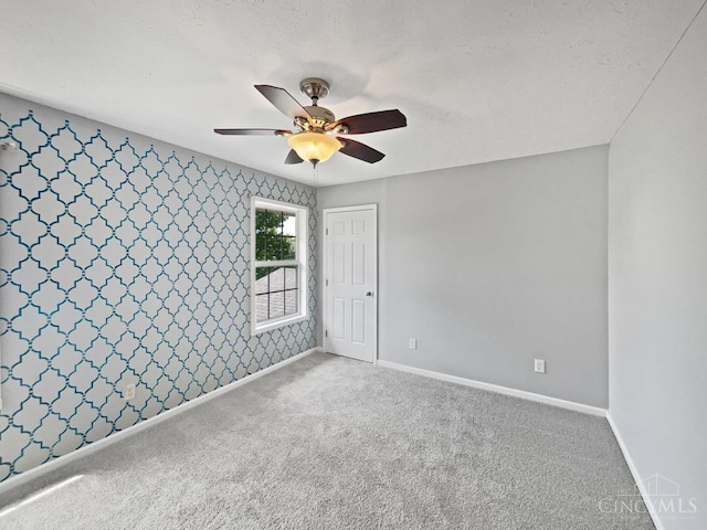 6336 Lansing Ct, Liberty Twp, OH 45011 - empty room featuring a ceiling fan, wallpapered walls, and carpet