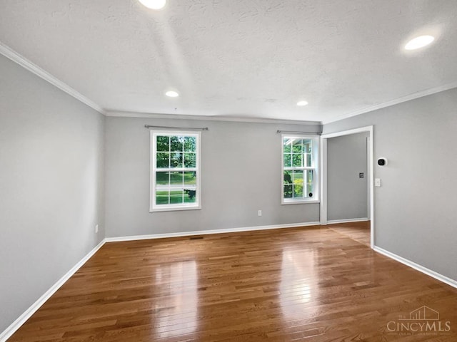 6336 Lansing Ct, Liberty Twp, OH 45011 - empty room with crown molding, wood finished floors, recessed lighting, and a textured ceiling