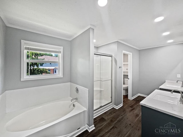 6336 Lansing Ct, Liberty Twp, OH 45011 - bathroom featuring a garden tub, a shower stall, ornamental molding, wood finished floors, and double vanity