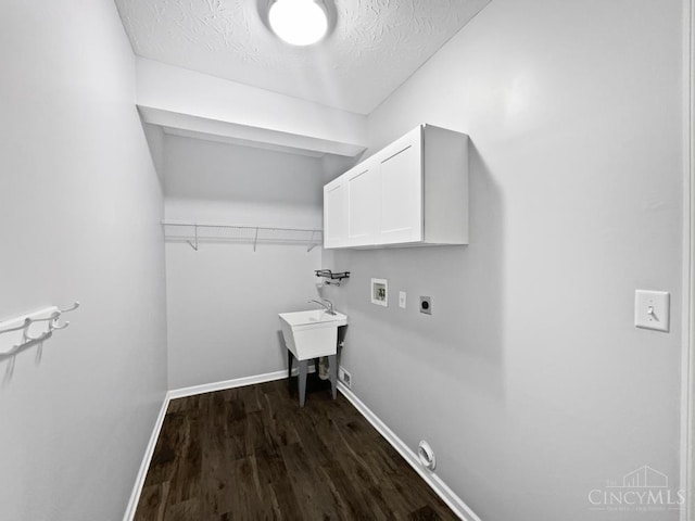 6336 Lansing Ct, Liberty Twp, OH 45011 - laundry room with cabinet space, hookup for a washing machine, a textured ceiling, dark wood-style flooring, and electric dryer hookup
