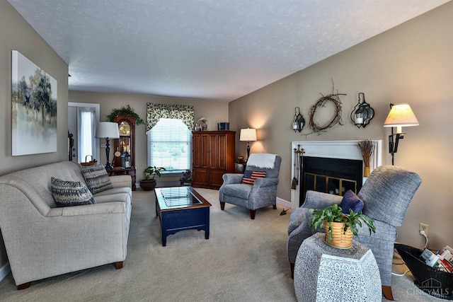 8050 Redhaven Ct, Colerain Twp, OH 45247 - living room with a glass covered fireplace, carpet floors, and a textured ceiling