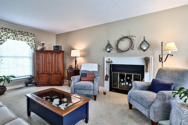 8050 Redhaven Ct, Colerain Twp, OH 45247 - carpeted living area featuring a glass covered fireplace and baseboards