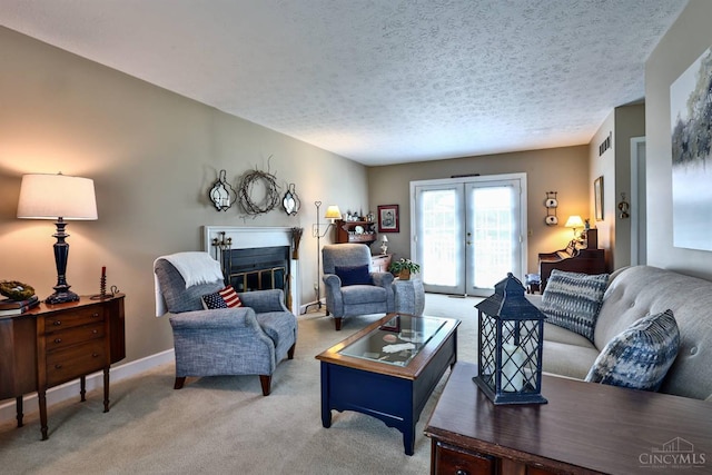 8050 Redhaven Ct, Colerain Twp, OH 45247 - living area with light carpet, a textured ceiling, and a glass covered fireplace