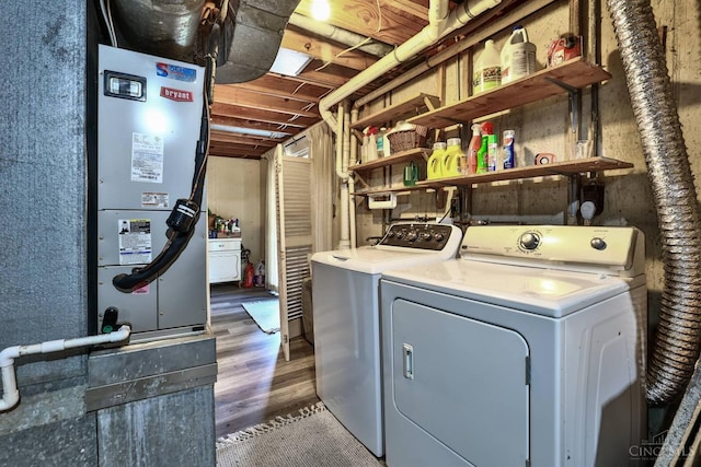 8050 Redhaven Ct, Colerain Twp, OH 45247 - washroom featuring washer and dryer and light wood-style flooring