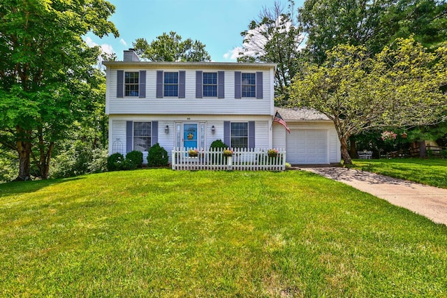 8050 Redhaven Ct, Colerain Twp, OH 45247 - colonial home featuring driveway, a garage, a chimney, and a front lawn
