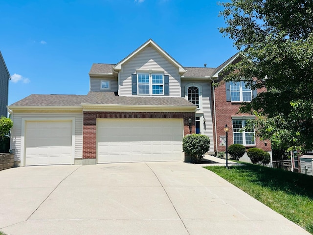 544 Mitchell Way Ct, Delhi Twp, OH 45238 - view of front of house with concrete driveway, brick siding, and a garage