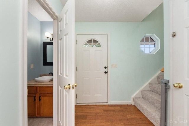 216 Lights Pointe Ct, New Richmond, OH 45157 - entrance foyer featuring light wood-type flooring and stairs