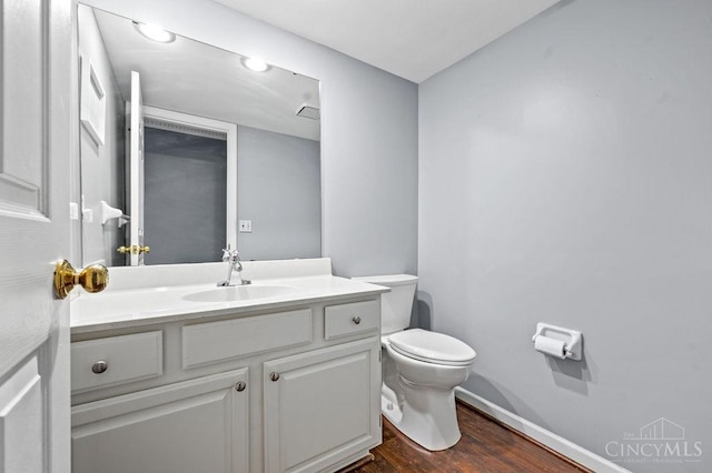 7029 Stonington Rd, Anderson Twp, OH 45230 - half bathroom with vanity and wood finished floors