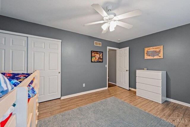 7029 Stonington Rd, Anderson Twp, OH 45230 - bedroom with wood finished floors, a closet, and a ceiling fan