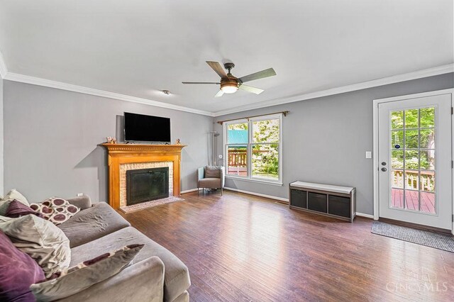 7029 Stonington Rd, Anderson Twp, OH 45230 - living room with ornamental molding, wood finished floors, a fireplace with flush hearth, and ceiling fan