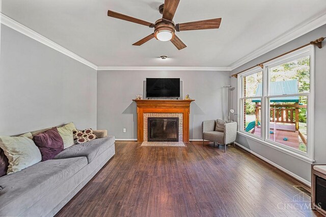 7029 Stonington Rd, Anderson Twp, OH 45230 - living area with wood finished floors, a ceiling fan, a brick fireplace, and ornamental molding