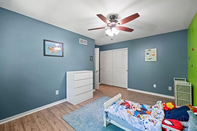 7029 Stonington Rd, Anderson Twp, OH 45230 - bedroom with wood finished floors, a closet, and ceiling fan