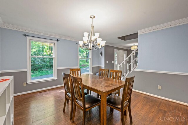 7029 Stonington Rd, Anderson Twp, OH 45230 - dining area with a chandelier, wood finished floors, and crown molding