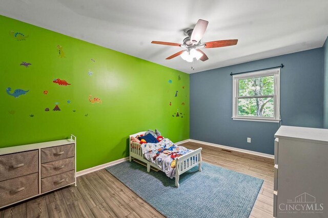 7029 Stonington Rd, Anderson Twp, OH 45230 - bedroom featuring wood finished floors and a ceiling fan