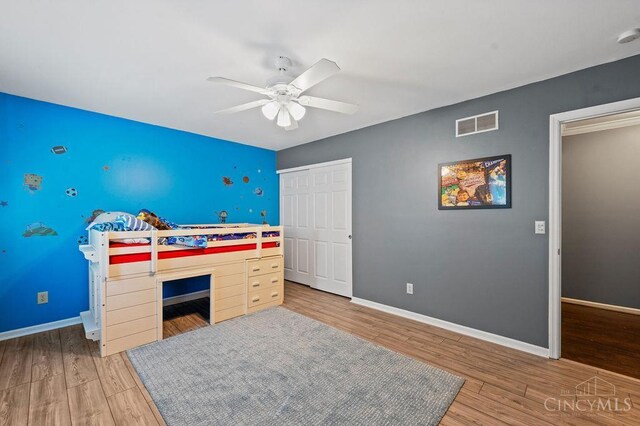 7029 Stonington Rd, Anderson Twp, OH 45230 - bedroom featuring wood finished floors, a closet, and ceiling fan