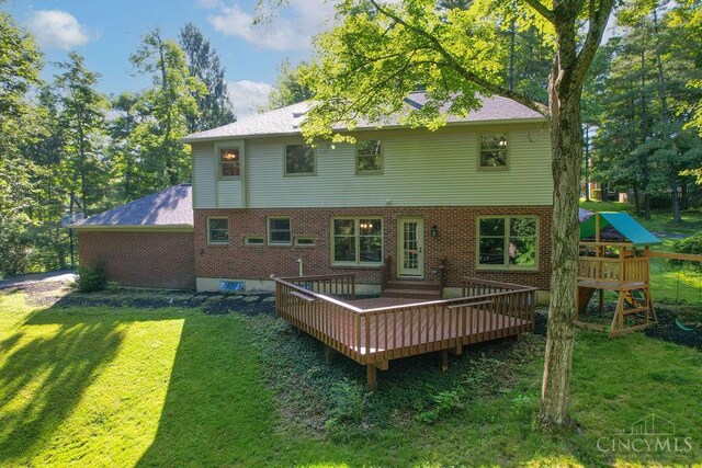 7029 Stonington Rd, Anderson Twp, OH 45230 - back of house with a yard, a wooden deck, and brick siding