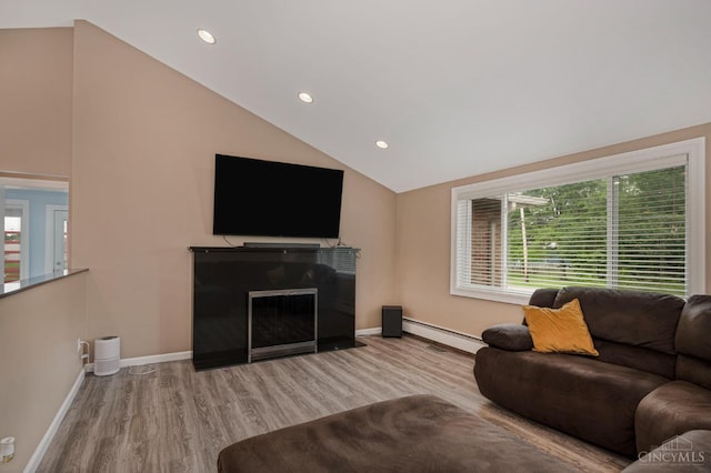 854 Nordyke Rd, Anderson Twp, OH 45255 - living room featuring wood finished floors, lofted ceiling, a baseboard heating unit, recessed lighting, and a fireplace