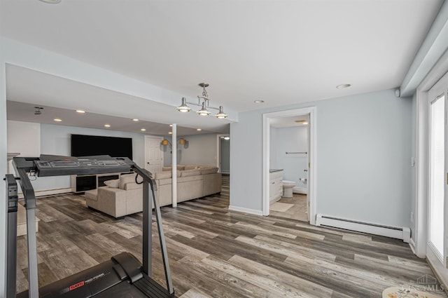 854 Nordyke Rd, Anderson Twp, OH 45255 - exercise area featuring a baseboard radiator, wood finished floors, and recessed lighting