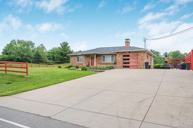 854 Nordyke Rd, Anderson Twp, OH 45255 - view of front of property featuring a chimney, an attached garage, concrete driveway, and brick siding
