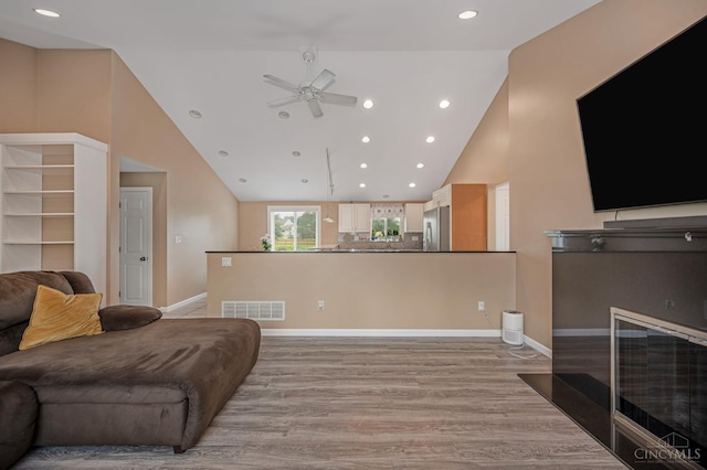 854 Nordyke Rd, Anderson Twp, OH 45255 - living room with ceiling fan, recessed lighting, light wood-type flooring, and high vaulted ceiling