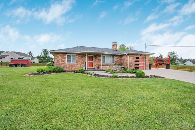 854 Nordyke Rd, Anderson Twp, OH 45255 - view of front facade with driveway, a chimney, brick siding, and a garage