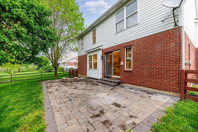 5815 Running Fox Ln, Mason, OH 45040 - rear view of house with a patio area, brick siding, and a fire pit