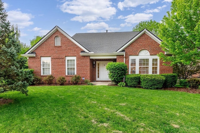 5815 Running Fox Ln, Mason, OH 45040 - view of front of house featuring brick siding, a front yard, and roof with shingles