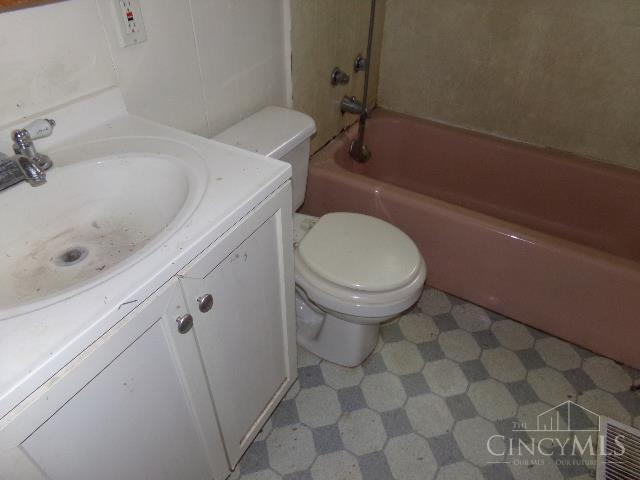 2528 Mariposa Dr, Colerain Twp, OH 45231 - bathroom featuring tile patterned floors, vanity, and washtub / shower combination