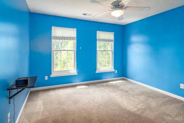 3773 Top Flite Ln, Mason, OH 45040 - carpeted empty room featuring healthy amount of natural light, a ceiling fan, and a textured ceiling