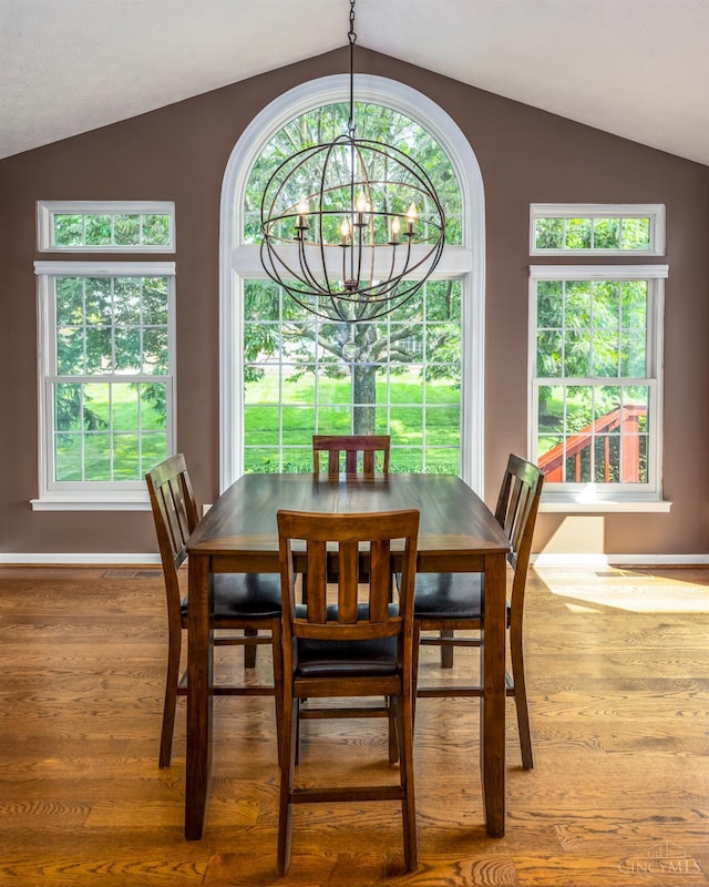 3773 Top Flite Ln, Mason, OH 45040 - dining room with vaulted ceiling, wood finished floors, a chandelier, and healthy amount of natural light