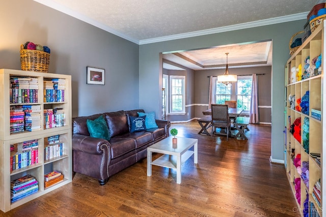 3773 Top Flite Ln, Mason, OH 45040 - living area featuring wood finished floors, crown molding, a tray ceiling, and a textured ceiling