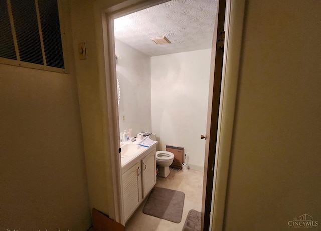2920 Spruceway Dr, Colerain Twp, OH 45251 - bathroom featuring vanity, a textured ceiling, and radiator heating unit