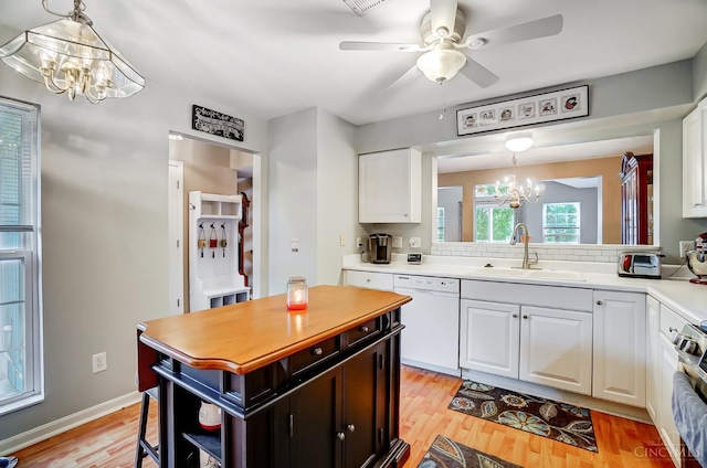 5788 Spire Ridge Ct Unit 13B, Green Twp, OH 45247 - kitchen featuring a chandelier, dishwasher, light countertops, and white cabinets
