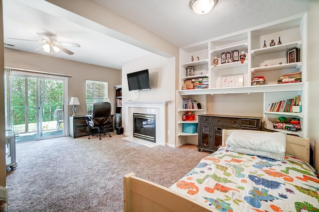 5788 Spire Ridge Ct Unit 13B, Green Twp, OH 45247 - bedroom featuring access to exterior, carpet, and a fireplace with flush hearth