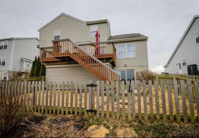 420 Lake Shore Dr, Lebanon, OH 45036 - back of house with stairway, a deck, and a fenced backyard